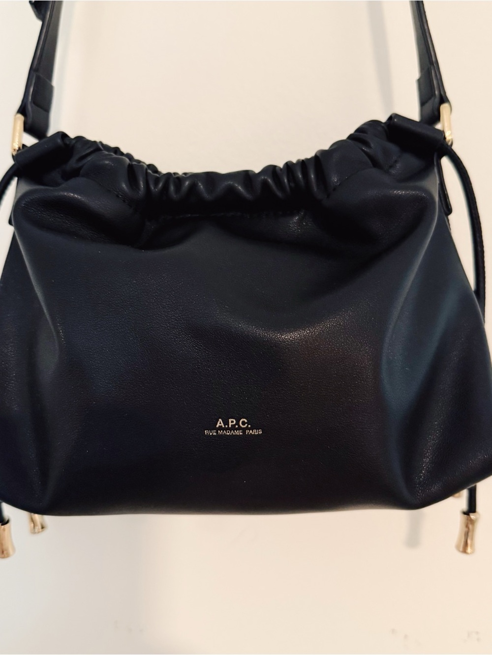 A.P.C. Black Leather Drawstring Ninon Crossbody Bag with Gold Hardware